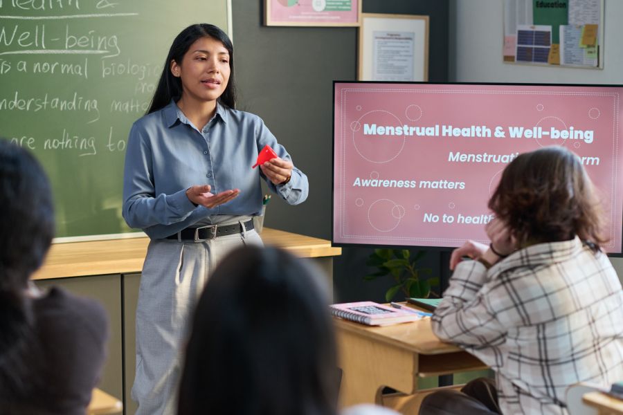 woman teaches class on menstruation